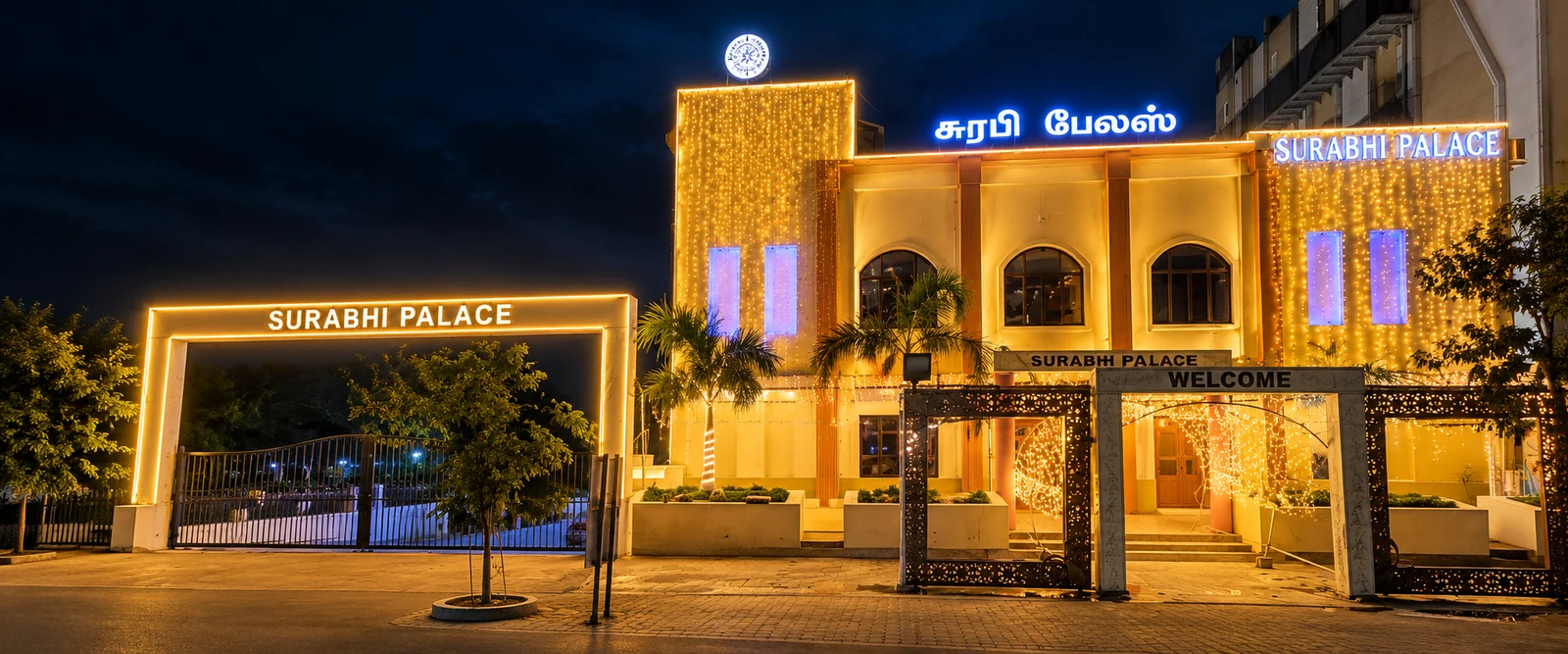 Surabhi Palace entrance glowing with lights at night